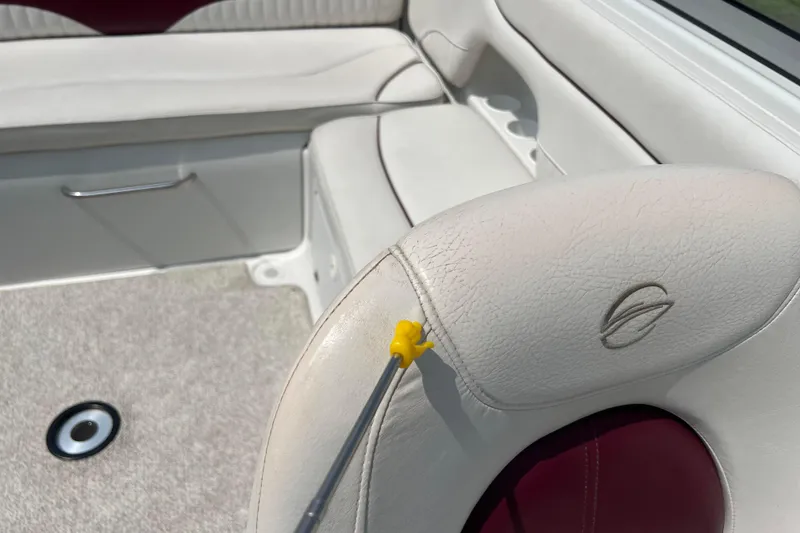 Slide: The Image of 2003 Crownline 230 BR boat interior with white leather seating and logo detail. - 41