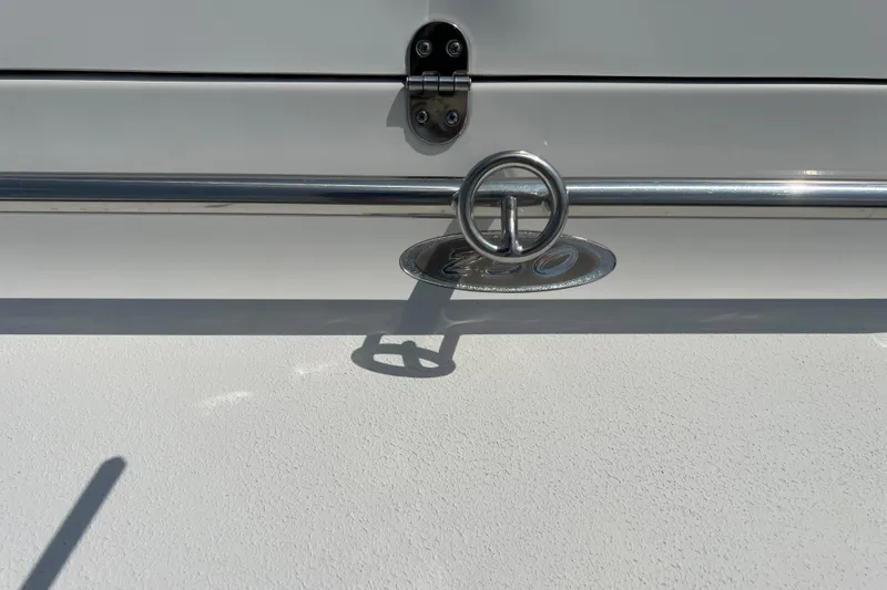 Slide: The Image of 2003 Crownline 230 BR boat detail with chrome railing and emblem. - 67