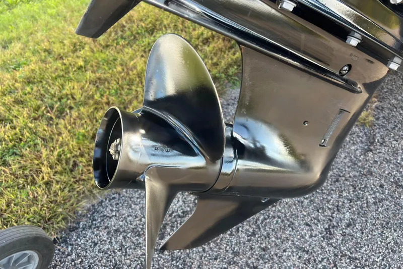 Slide: The Image of Close-up of a 2022 Viaggio Diamante Q boat propeller on gravel and grass background. - 10