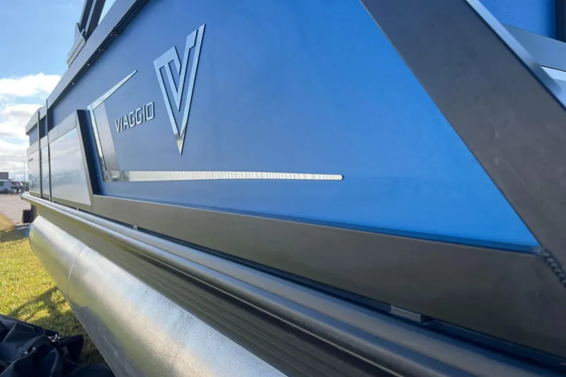 Slide: The Image of 2022 Viaggio Diamante Q pontoon boat with sleek blue exterior design. - 14