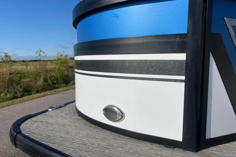 Slide: The Image of 2022 Viaggio Diamante Q boat detail with blue and white exterior, parked outdoors. - 19