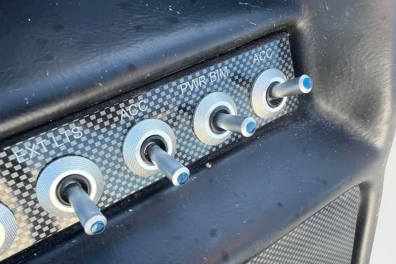 Slide: The Image of Control panel with toggle switches in a 2022 Viaggio Diamante Q vehicle. - 41