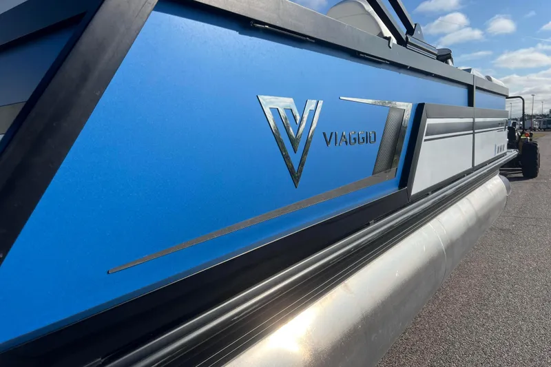 Slide: The Image of 2022 Viaggio Diamante Q pontoon boat with blue and silver detailing. - 8