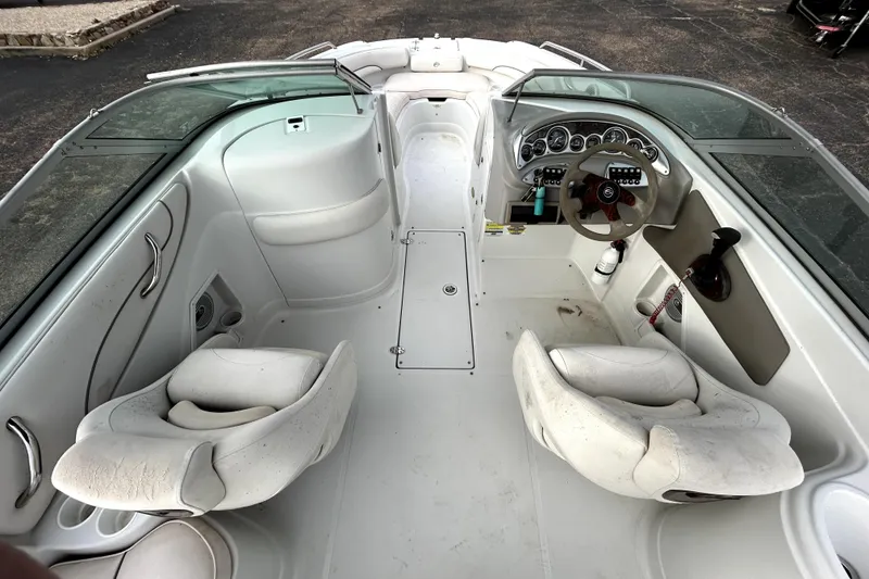 Slide: The Image of 2005 Crownline 220 LS boat interior with dual seats and steering console. - 11