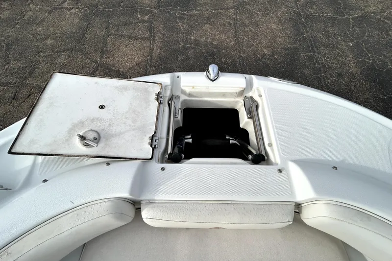 Slide: The Image of 2005 Crownline 220 LS boat bow storage compartment with open hatch. - 15