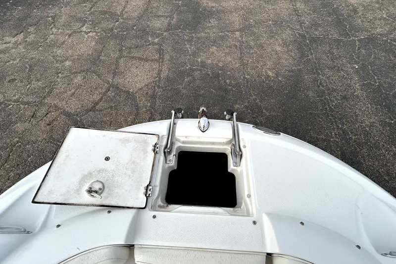 Slide: The Image of 2005 Crownline 220 LS boat bow with anchor storage and hatch. - 16