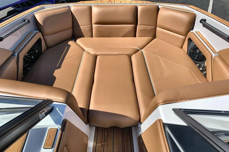 Slide: The Image of Luxurious tan seating in 2026 Moomba Max boat interior. - 11