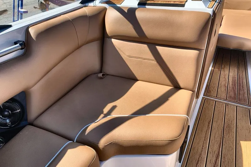 Slide: The Image of Luxurious tan seating in 2026 Moomba Max boat interior with wood-style flooring. - 17