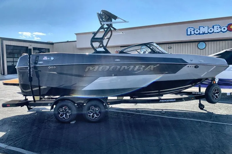 Slide: The Image of 2026 Moomba Max boat on trailer in sunny outdoor setting. - 6