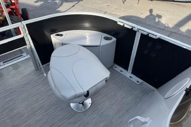 Slide: The Image of 2022 Bennington S 18 Fishing boat interior with swivel seat and storage compartment. - 10