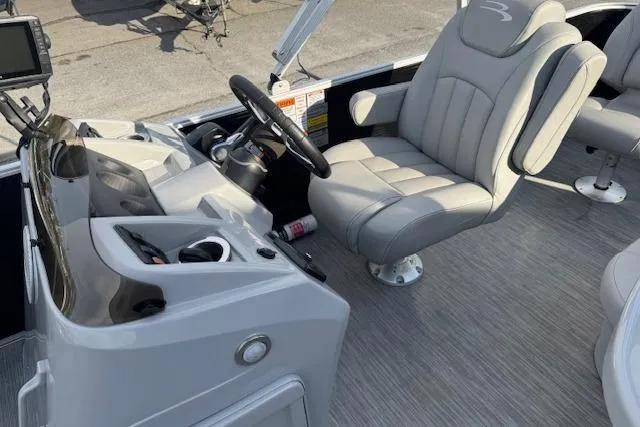 Slide: The Image of 2022 Bennington S 18 Fishing boat interior with steering console and comfortable seating. - 11