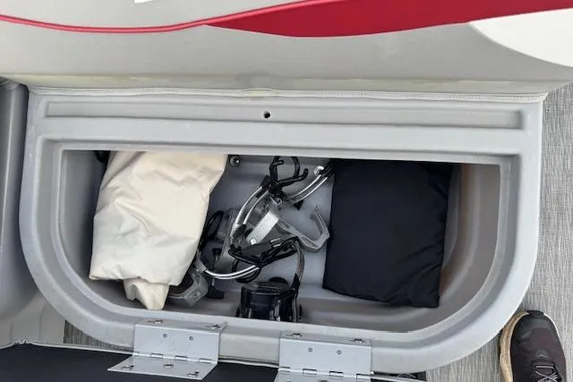 Slide: The Image of Storage compartment of 2022 Bennington S 18 Fishing boat with gear and accessories. - 18