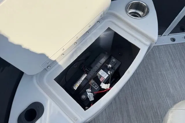 Slide: The Image of 2022 Bennington S 18 Fishing boat battery compartment with cup holder and storage. - 20