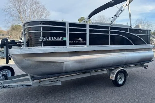 Slide: The Image of 2022 Bennington S 18 Fishing pontoon boat on trailer, side view. - 3