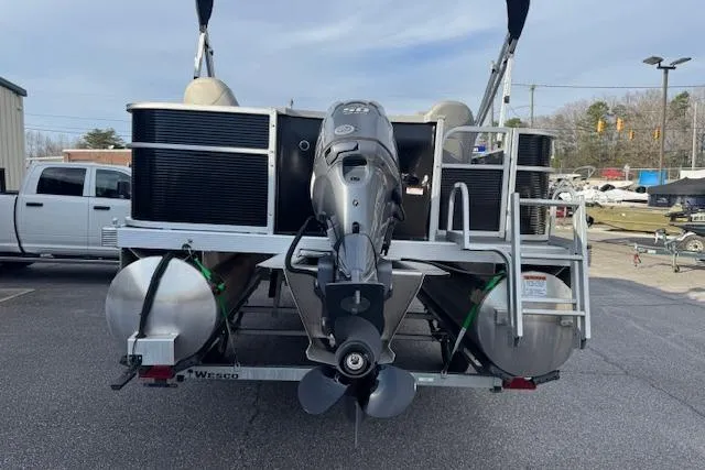 Slide: The Image of 2022 Bennington S 18 Fishing boat rear view with outboard motor and trailer. - 4