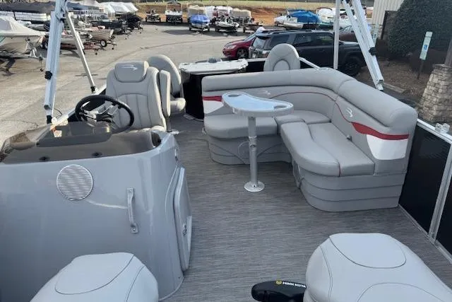 Slide: The Image of 2022 Bennington S 18 Fishing boat interior with seating and steering console. - 7