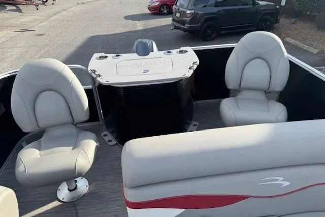 Slide: The Image of 2022 Bennington S 18 Fishing boat interior with seating and console. - 8