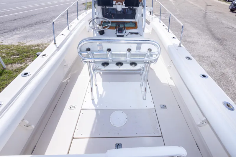 Slide: The Image of 1997 Robalo R230 Center Console boat interior with steering wheel and seating. - 26