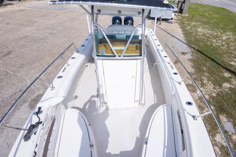 Slide: The Image of 1997 Robalo R230 Center Console boat with spacious deck and center console. - 27