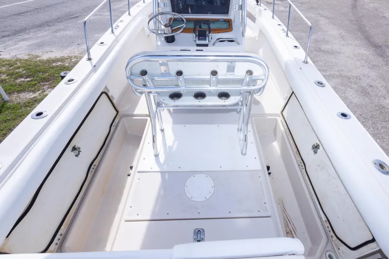 Slide: The Image of 1997 Robalo R230 Center Console boat interior with seating and storage compartments. - 33
