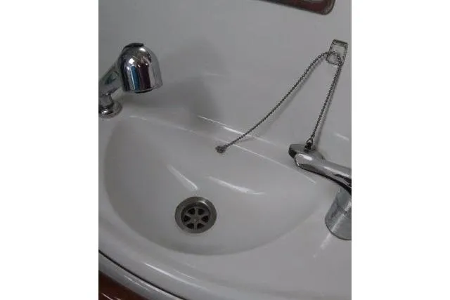 Slide: The Image of White sink with chrome faucets on a 2005 Beneteau 393 yacht. - 18