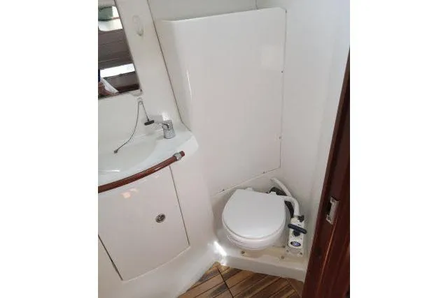 Slide: The Image of Bathroom interior of 2005 Beneteau 393 yacht with sink and toilet. - 28