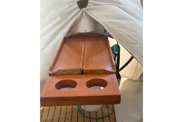 Slide: The Image of Wooden table with cup holders on a 2005 Beneteau 393 sailboat. - 33