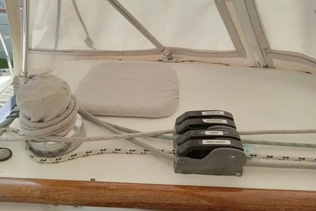 Slide: The Image of Deck of 2005 Beneteau 393 sailboat with winch and labeled rope clutches. - 36