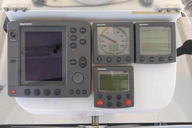Slide: The Image of Raymarine navigation instruments on a 2005 Beneteau 393 sailboat dashboard. - 37