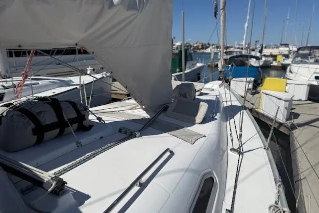 Slide: The Image of Sailboat Beneteau 393, 2005 model, docked at marina with clear blue sky. - 42