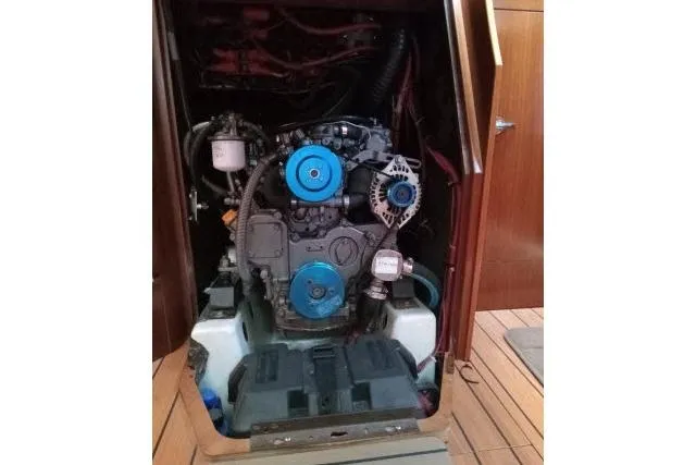 Slide: The Image of Engine compartment of a 2005 Beneteau 393 sailboat, showcasing mechanical components. - 48