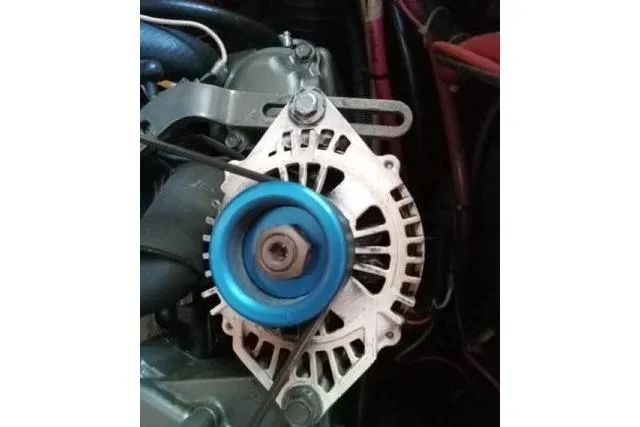 Slide: The Image of Alternator of a 2005 Beneteau 393 boat engine with blue pulley. - 50