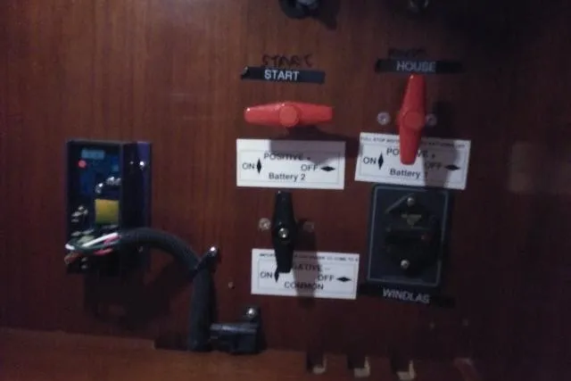Slide: The Image of Electrical panel of a 2005 Beneteau 393 sailboat with battery switches and controls. - 53