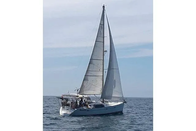 Slide: The Image of Sailing yacht Beneteau 393, 2005 model, cruising on open water under clear skies. - 56