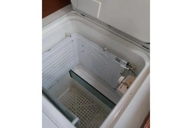 Slide: The Image of Open refrigerator compartment in 2005 Beneteau 393 yacht interior. - 9