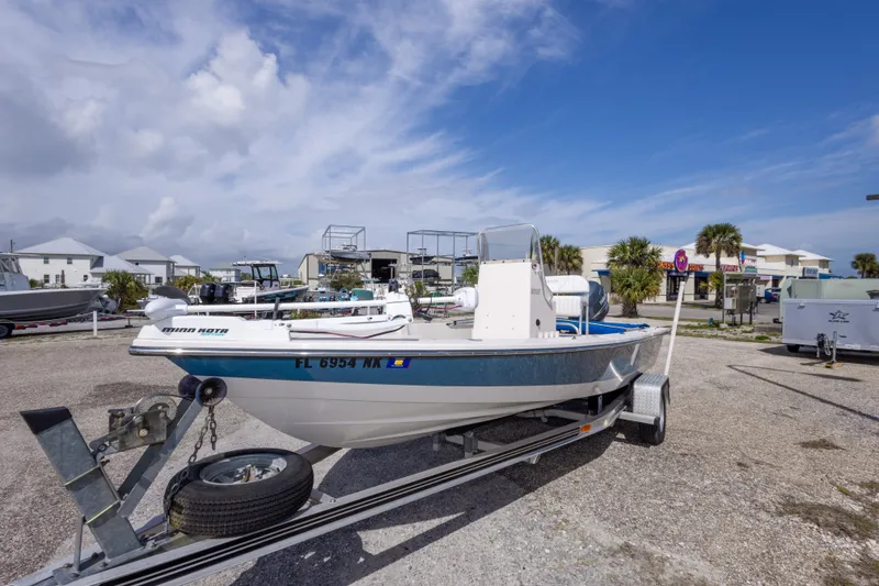 Slide: The Image of Boat on trailer in parking lot, 2007 Pathfinder 2000 V model, clear sky background. - 14