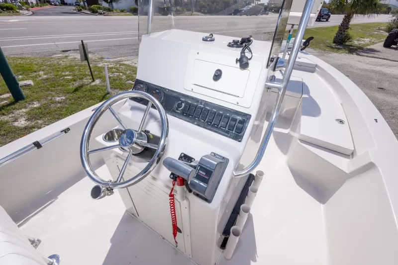 Slide: The Image of Center console of a 2007 Pathfinder 2000 V boat with steering wheel and controls. - 15