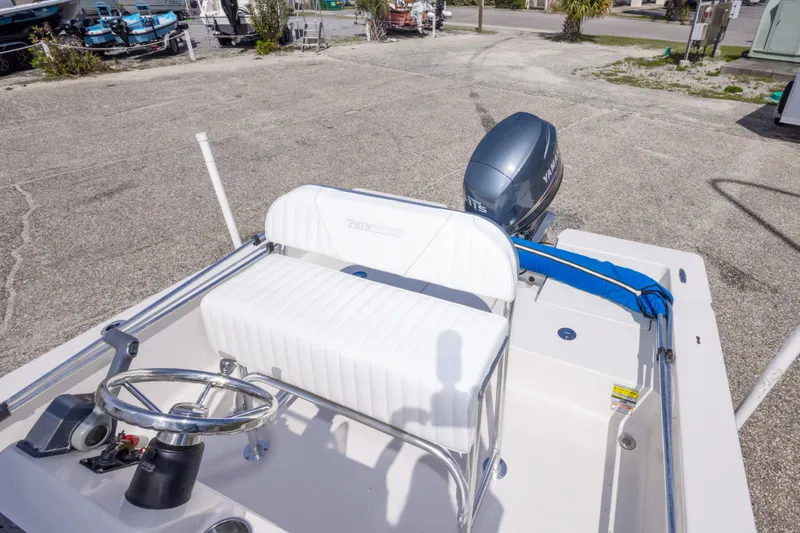 Slide: The Image of 2007 Pathfinder 2000 V boat with Yamaha outboard motor, white seating, and steering wheel. - 27