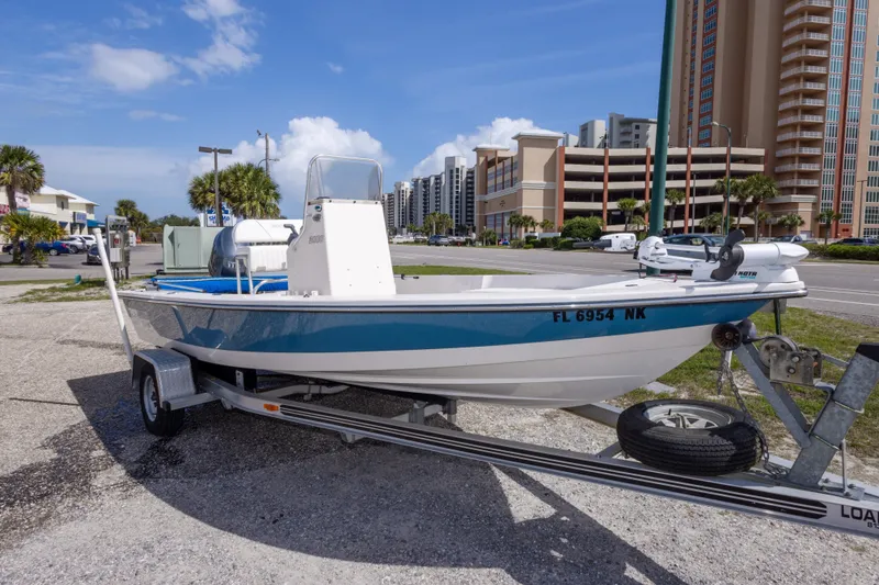 Slide: The Image of 2007 Pathfinder 2000 V boat on trailer, urban background, clear sky. - 3