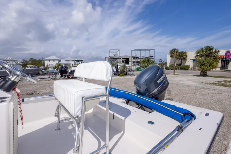 Slide: The Image of 2007 Pathfinder 2000 V boat with Yamaha engine, parked outdoors under a blue sky. - 33