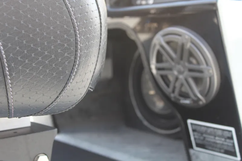 Slide: The Image of 2018 Mako 21 LTS boat interior with speaker and detailed upholstery. - 17