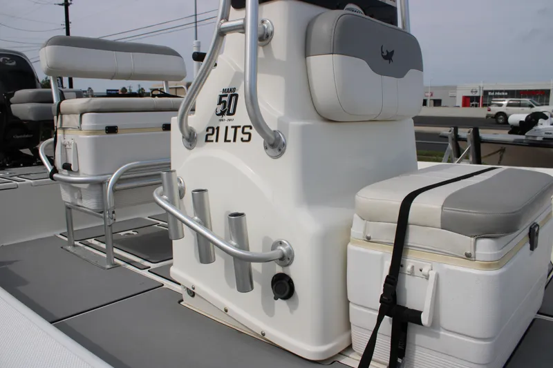 Slide: The Image of 2018 Mako 21 LTS boat interior with seating and storage compartments. - 4
