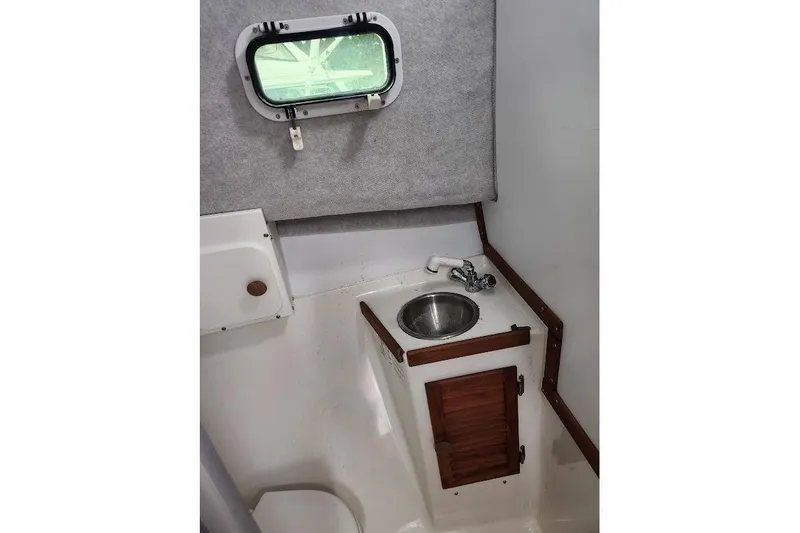 Slide: The Image of Compact boat interior with sink and wooden cabinet, Acadia Atlas 2018 model. - 11