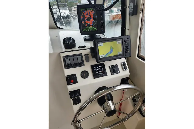 Slide: The Image of Boat cockpit with navigation screens and controls, Acadia Atlas 2018 model. - 3