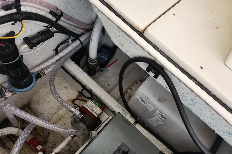 Slide: The Image of 2018 Acadia Atlas boat interior showing wiring and plumbing components. - 5