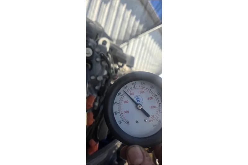 Slide: The Image of Pressure gauge reading on a 2006 Ranger Z19 Comanche boat engine. - 19