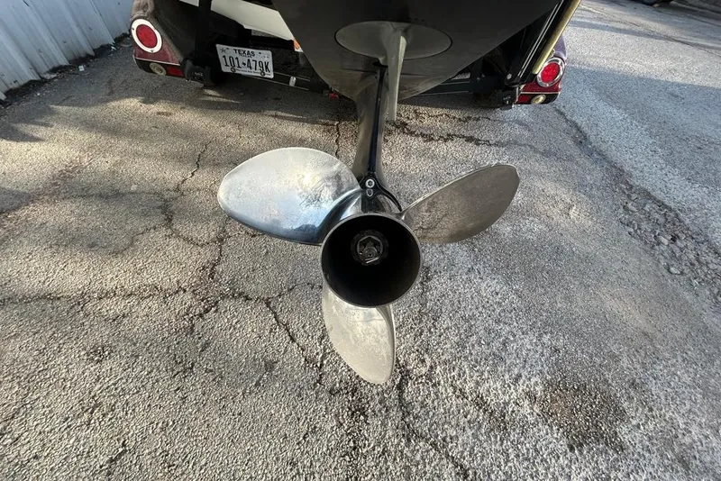 Slide: The Image of Propeller of a 2006 Ranger Z19 Comanche boat on a trailer, Texas license plate visible. - 7