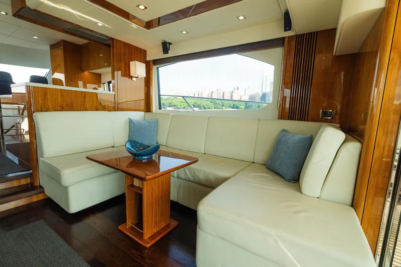 Slide: The Image of Luxurious interior of 2016 Sunseeker Manhattan 65 yacht with elegant seating and wooden accents. - 10