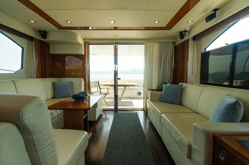 Slide: The Image of Luxurious interior of 2016 Sunseeker Manhattan 65 yacht with elegant seating and wood accents. - 13