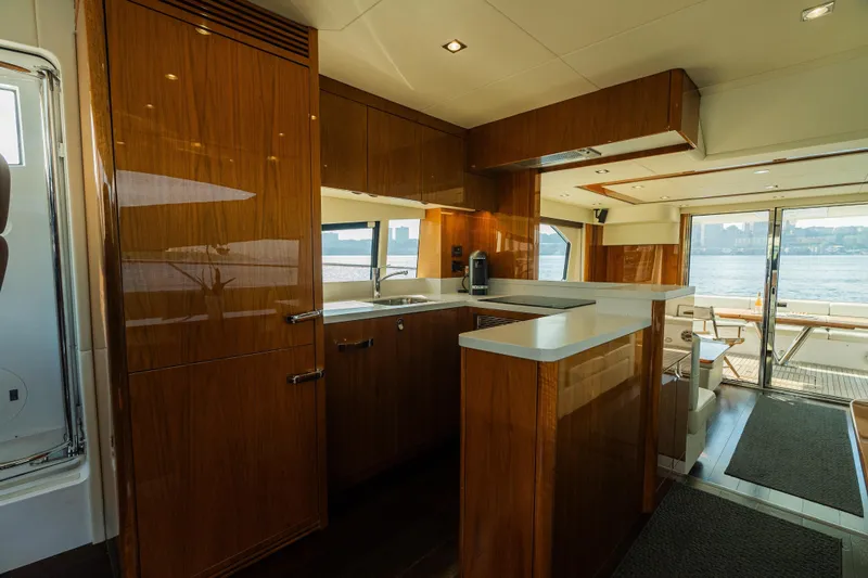 Slide: The Image of Luxurious interior of 2016 Sunseeker Manhattan 65 yacht with modern kitchen and waterfront view. - 17